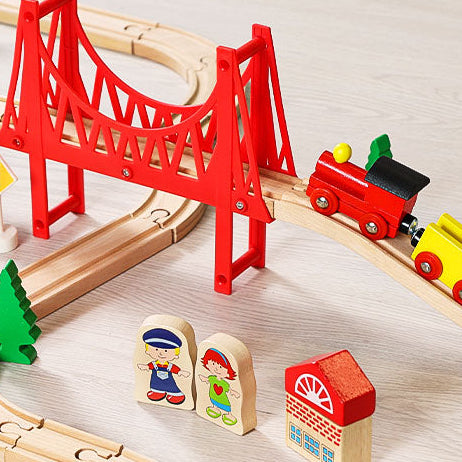 Wooden train set with red bridge and colorful trains