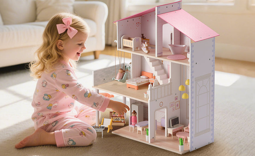 Child playing with a dollhouse in a living room