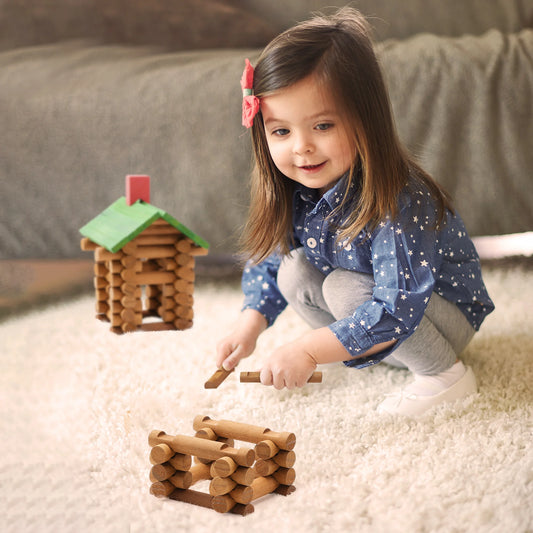 Child playing with wooden log toy houses-lincoln logs