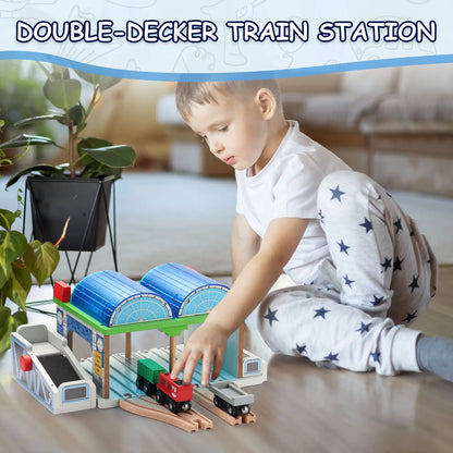 Child playing with a toy train set at a double-decker train station