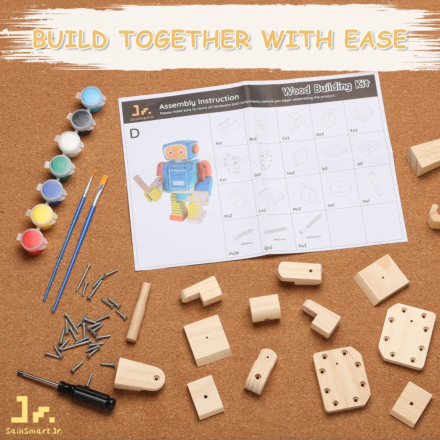 Wood building kit with wooden pieces, screws, paint, brushes, and assembly instructions on a cork board.