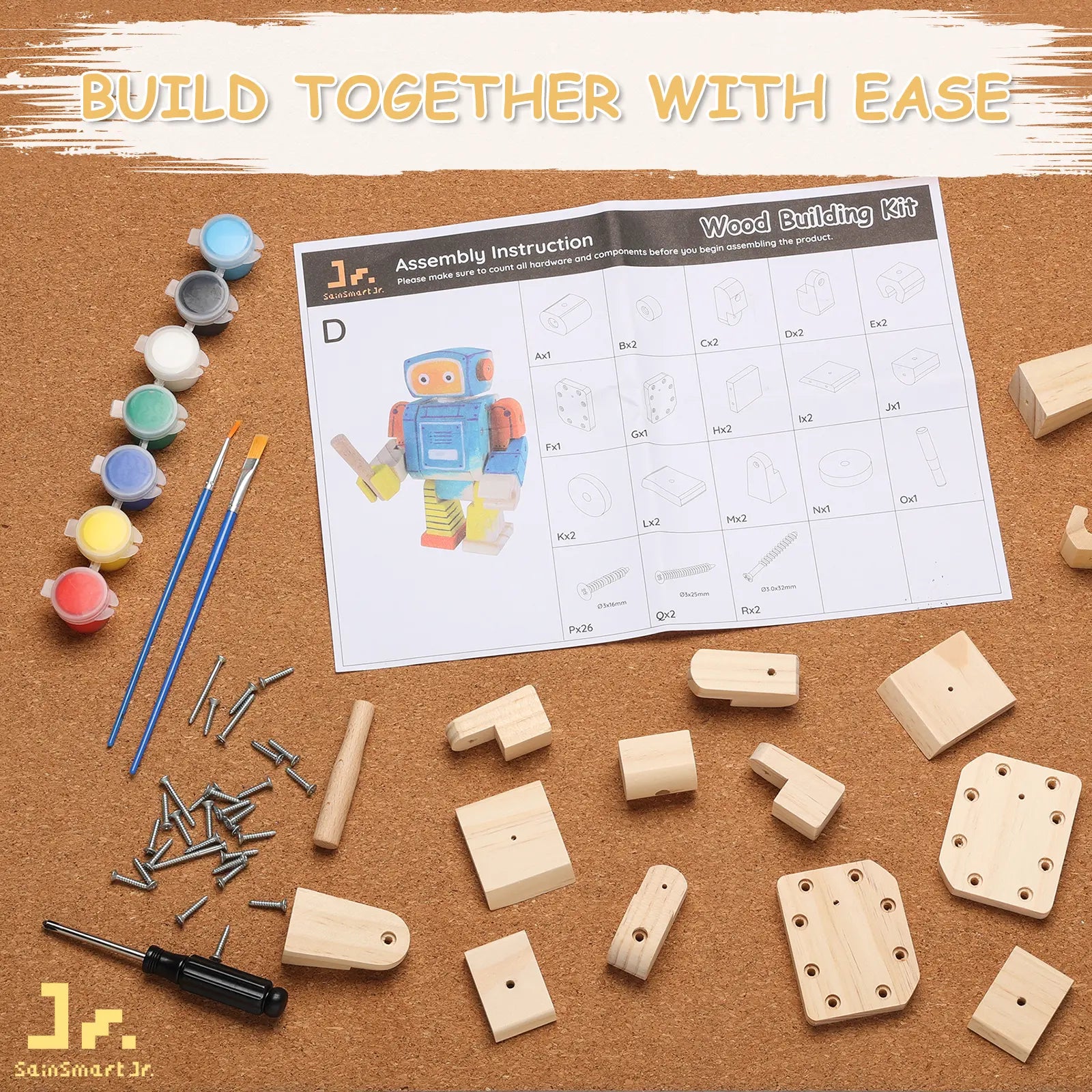 Wood building kit with wooden pieces, screws, paint, brushes, and assembly instructions on a cork board.