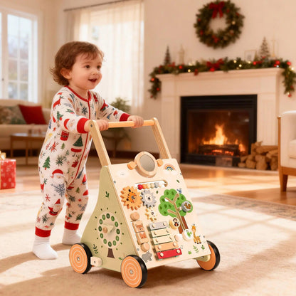 Child with a toy walker in a festively decorated living room with Christmas tree and fireplace.