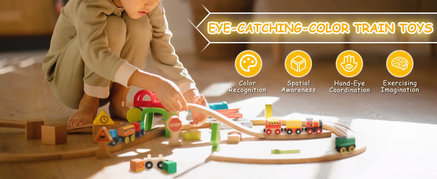 Child playing with a colorful train toy set on a wooden floor.