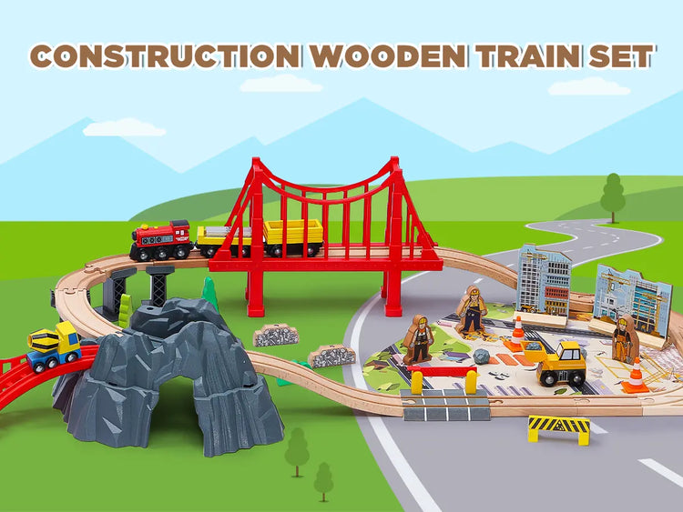 Construction wooden train set with a red bridge and various toy vehicles on a green landscape.