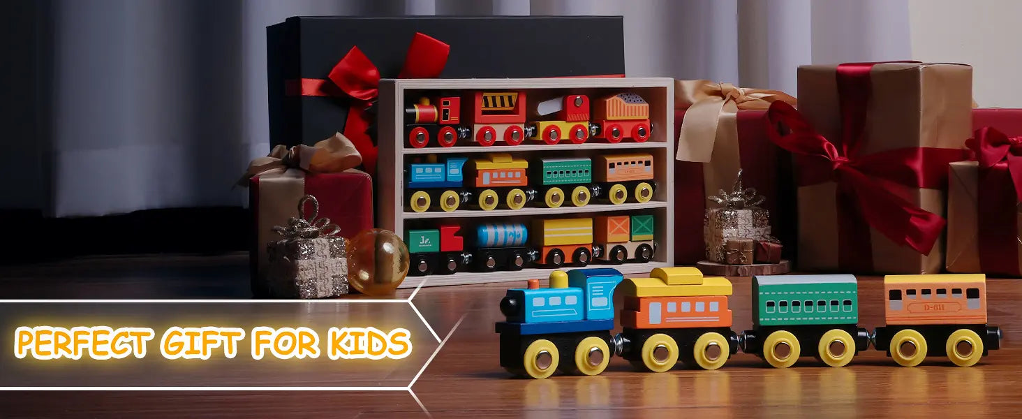 Colorful toy train set with gift boxes and ribbons on a wooden surface.
