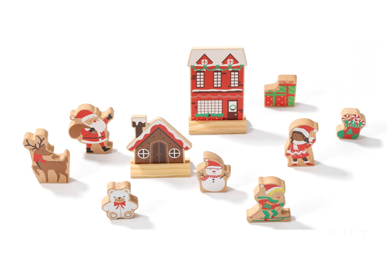 Set of wooden Christmas figures including houses and Santa Claus on a white background