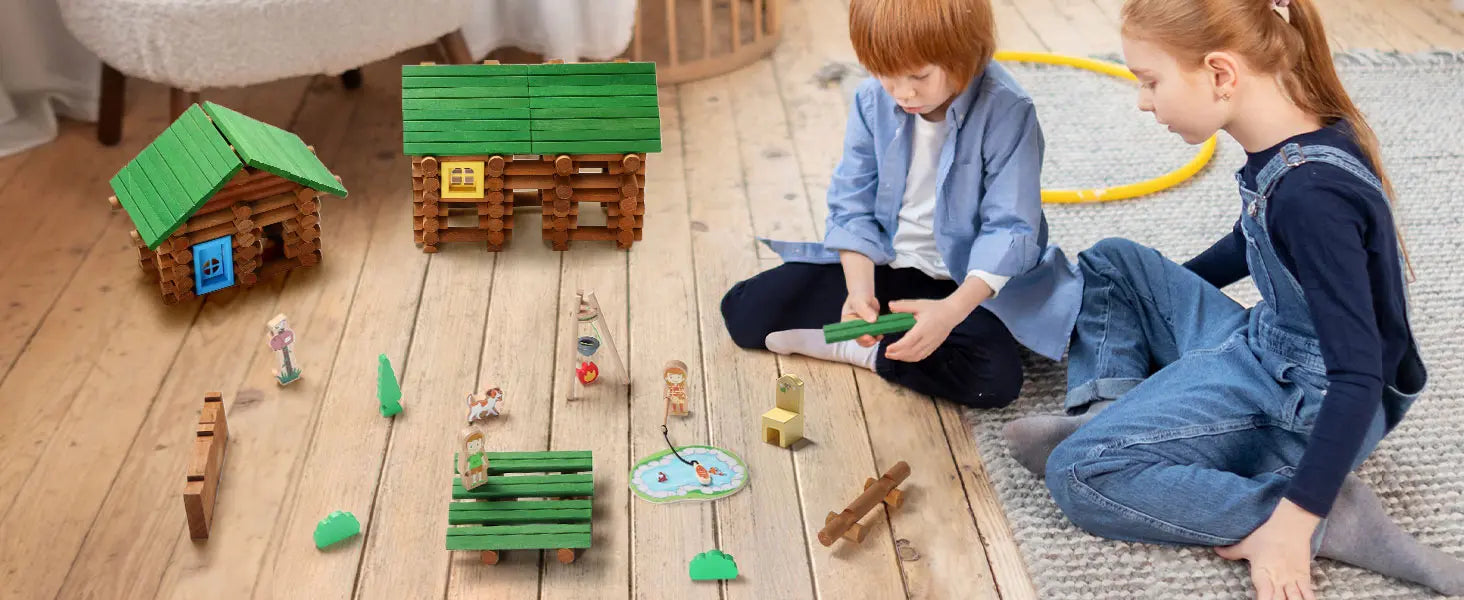 Children playing with toy houses and figures on a wooden floor.