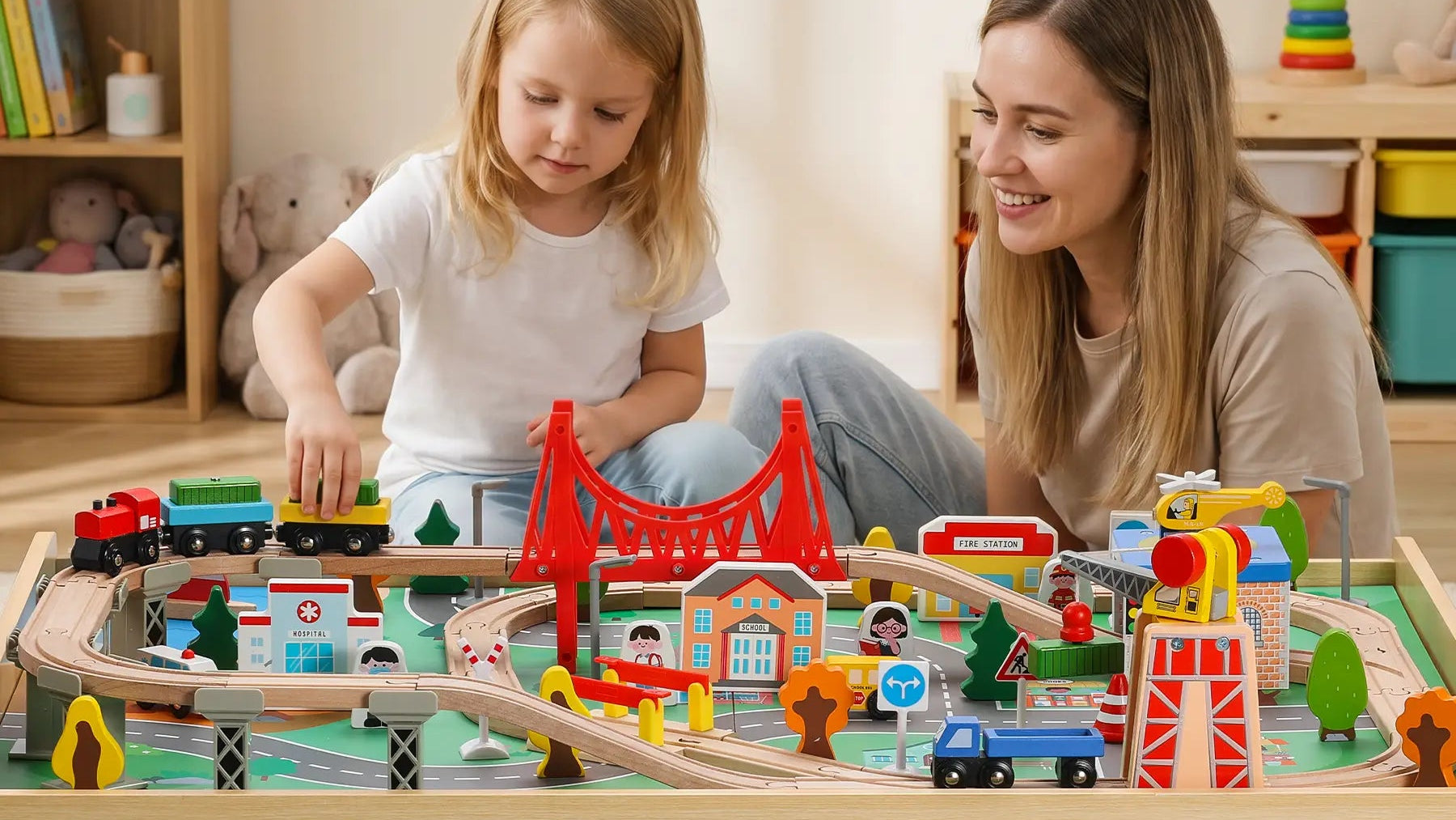 Playing with a toy train set on a wooden train table.