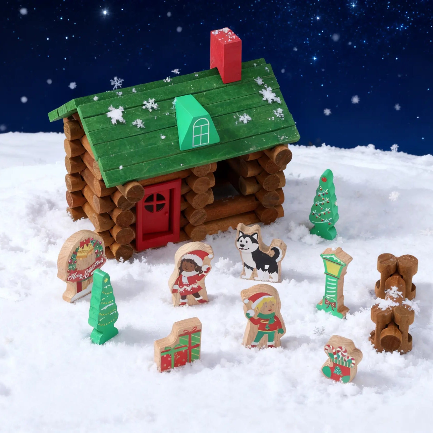 Toy log cabin with snowmen, dogs, and trees on a snowy landscape at night.