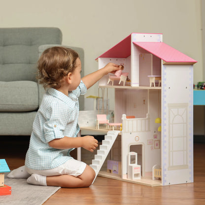 Child playing with a dollhouse in a living room