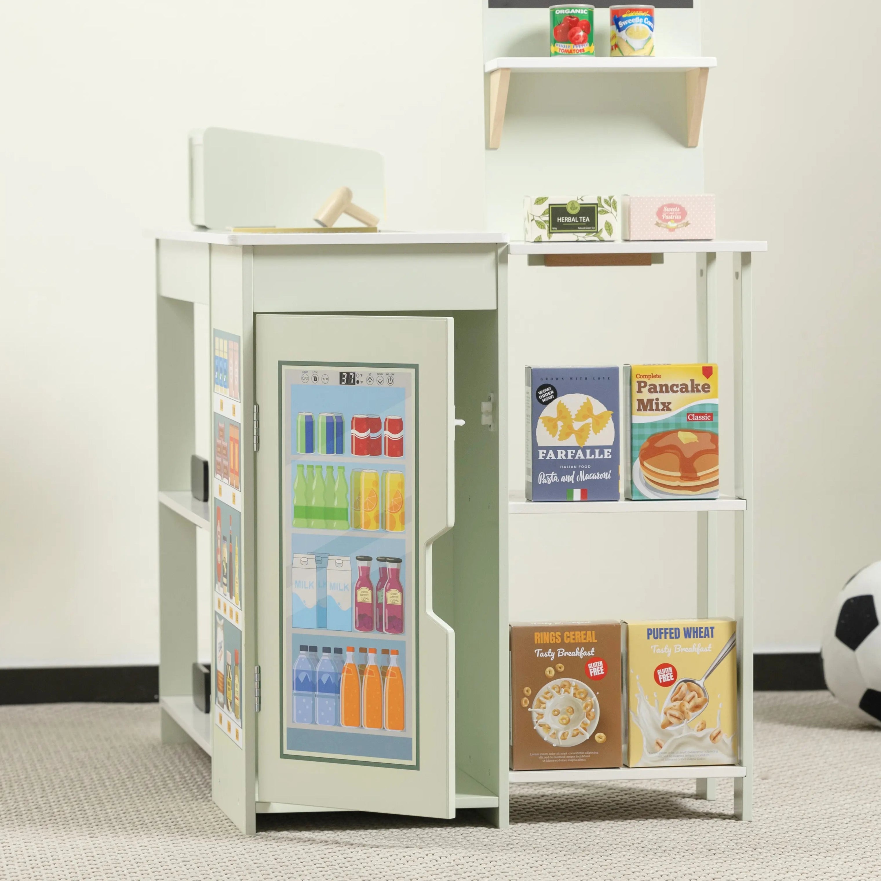 Small vending machine with snacks on a white shelf against a plain wall.