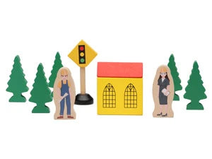 Toy figures of a woman, a house, and a traffic light with trees in the background on a white background
