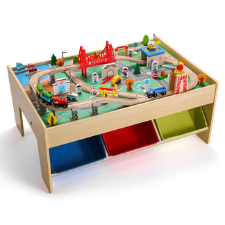 Toy train set on a wooden table with colorful bins underneath