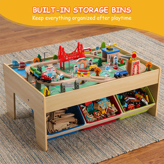 Toy train set with built-in storage bins on a wooden floor.