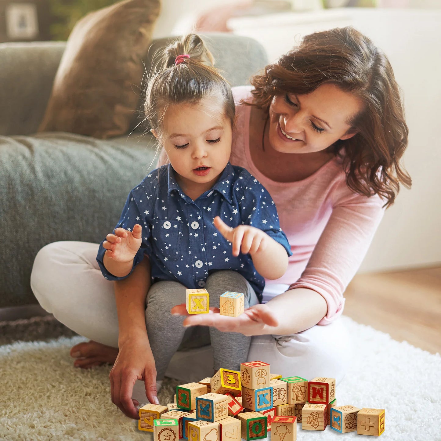 Woman and child playing with wooden blocks