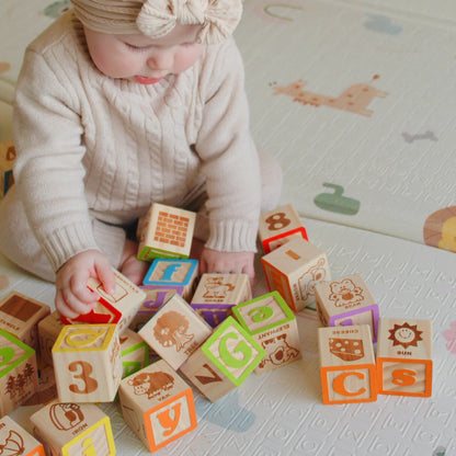 Baby playing with wooden blocks