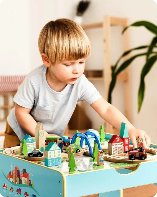 Child playing with wooden toys on a table in a bright room