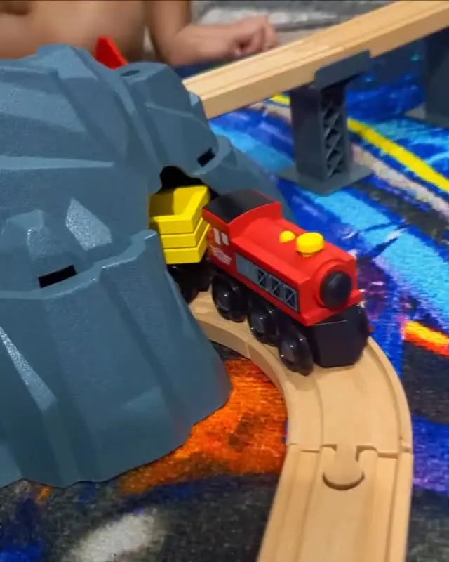 Toy train set with tracks on a play mat