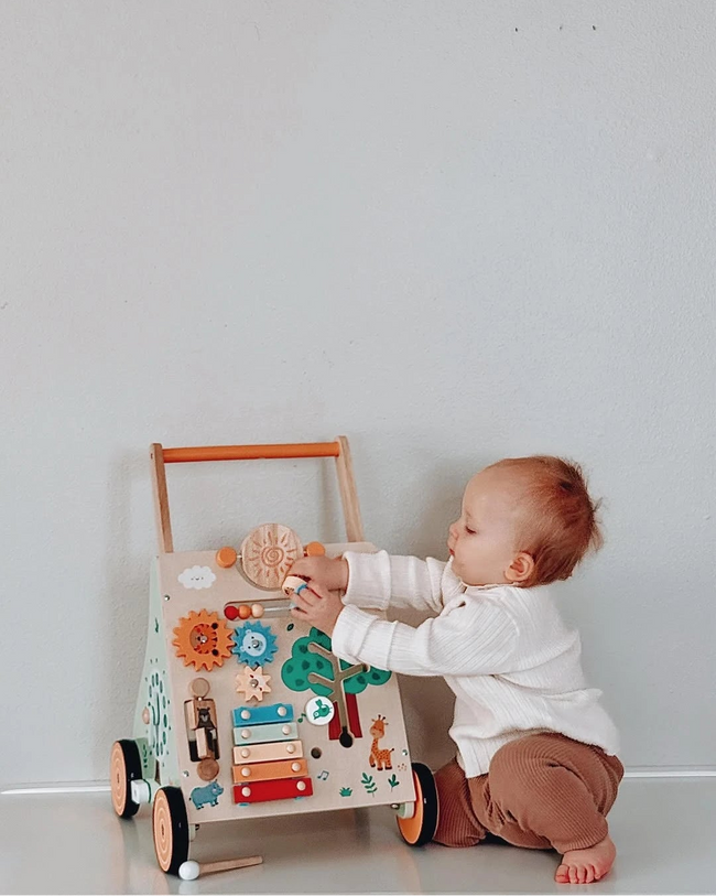 Baby playing with a wooden toy