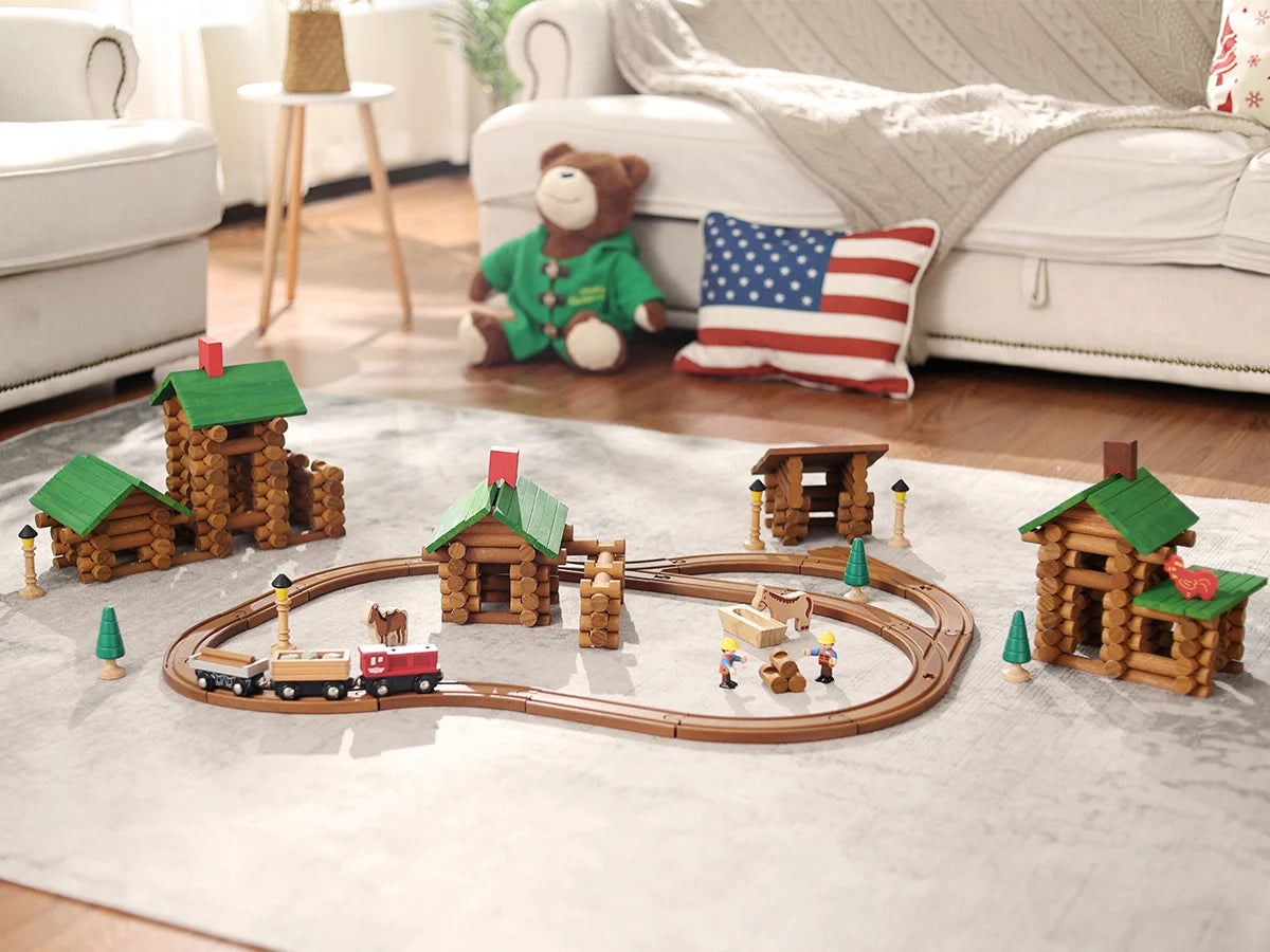 Toy train set with wooden log cabins toy