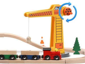 Toy crane with a train set on a wooden track